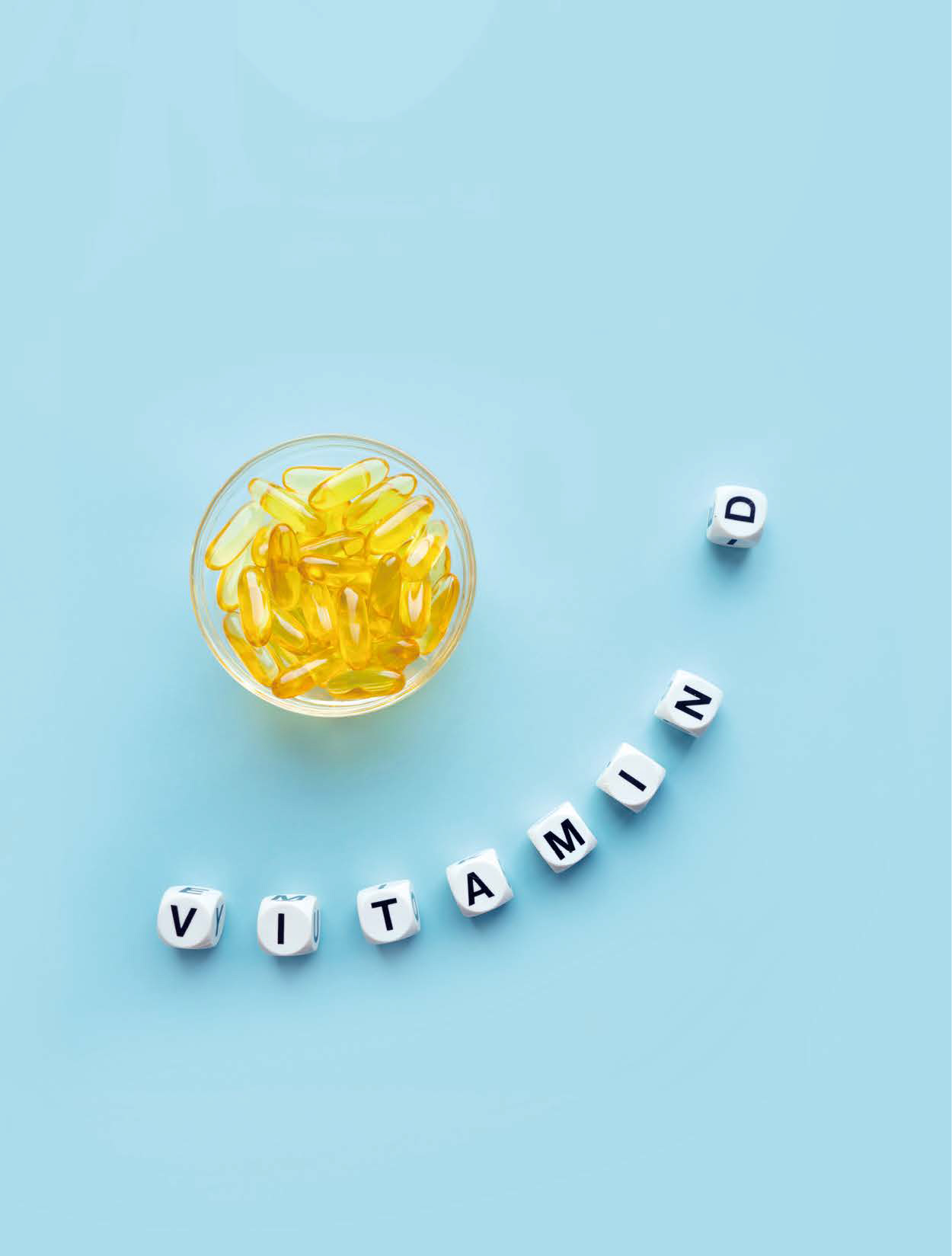 노란색 영양제가 담겨 있고, 그 밑에는 'VITAMIN D'라고 한글자 씩 써있는 블록이다.