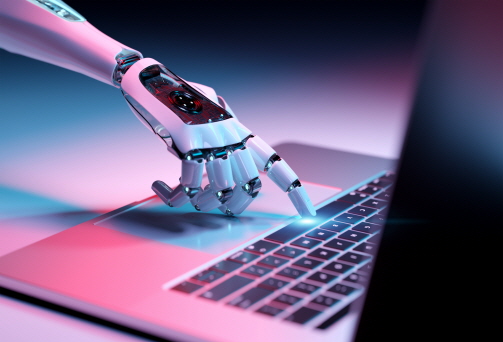 AI 가 노트북 키보드 자판을 누르는 모습이다.