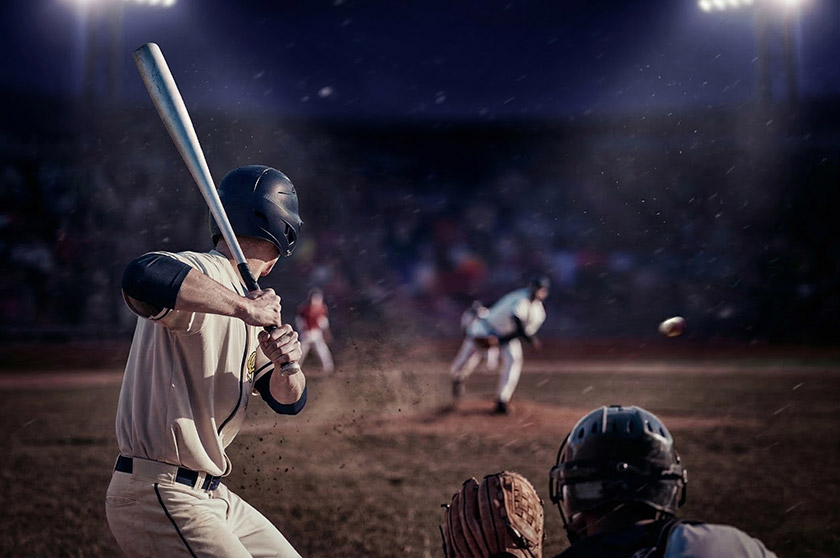 그라운드에서 야구 경기를 하는 야구선수들의 모습. '프로야구 개막' 및  '프로야구 시범경기 일정' 내용을 보조한다.